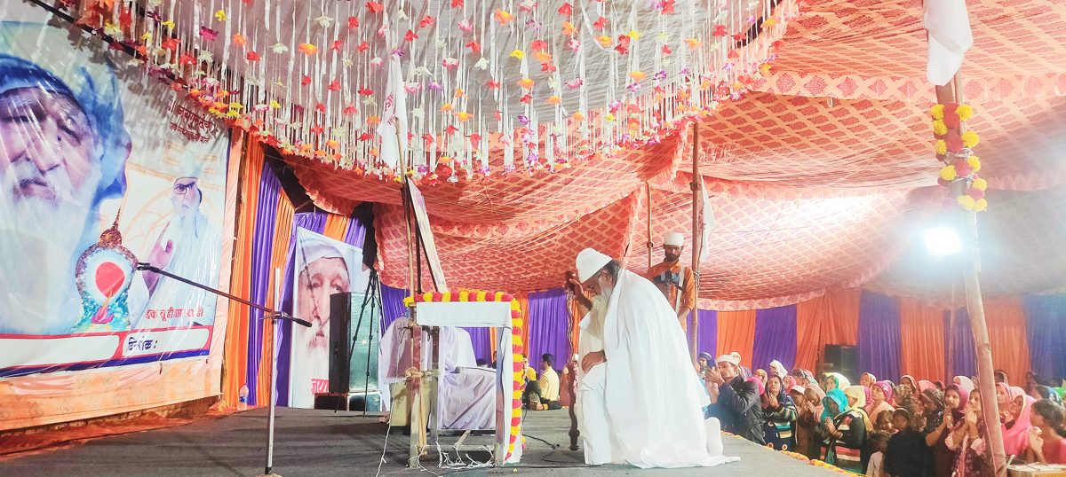 A decorated mandap at the Saket Mahayagya, devotees gathered in satsang